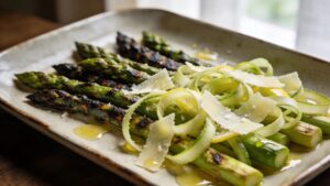 Variety of asparagus cooking techniques including grilled, roasted, and raw asparagus spears