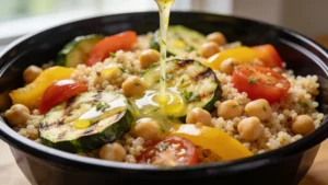Meal prep containers with quinoa, roasted vegetables, and greens on a wooden table