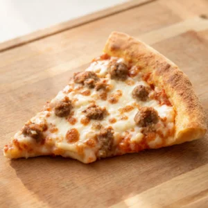 A freshly baked classic sausage and mozzarella pizza on a wooden board, sliced and ready to serve.