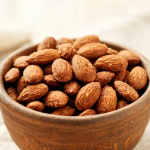 A bowl of easy classic cinnamon roasted almonds dusted with cinnamon sugar