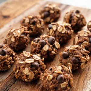 A batch of no-bake chocolate peanut butter bites on a plate